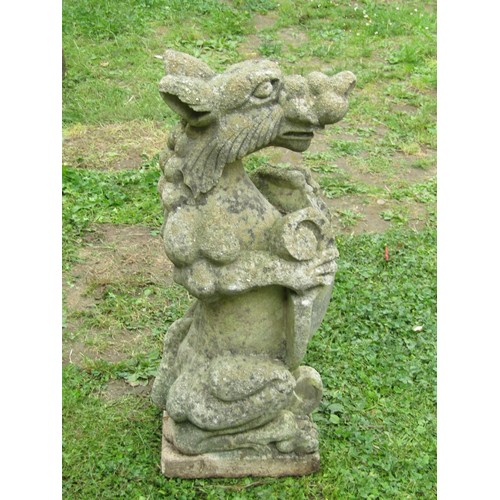 1060 - A weathered cast composition stone pier ornament in the form of a seated dragon clutching an armoria... 