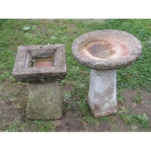 1062 - Two small weathered two sectional cast composition stone bird baths of varying design, 51 and 41 cm ... 