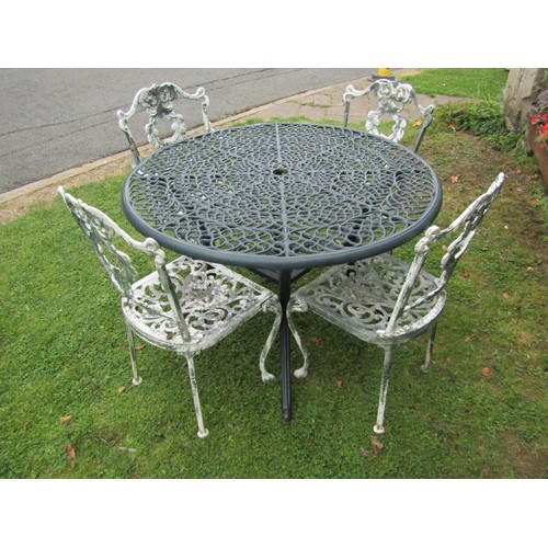 1085 - Green painted cast alloy garden terrace table of circular form with decorative pierced top 108 cm di... 