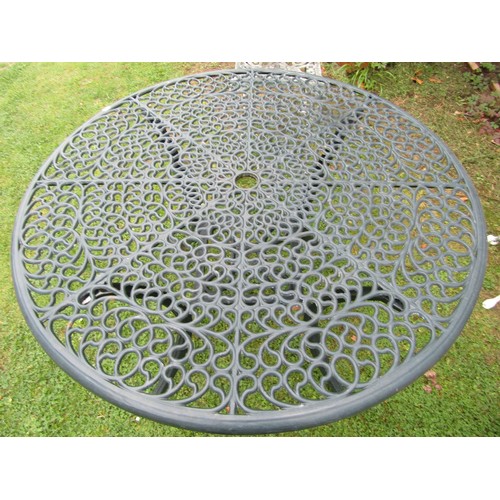 1085 - Green painted cast alloy garden terrace table of circular form with decorative pierced top 108 cm di... 