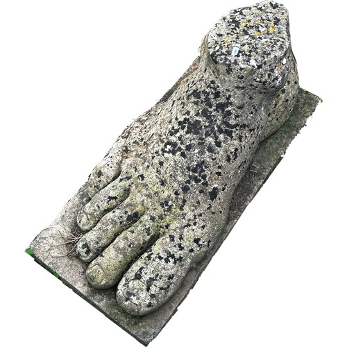 1061 - A large reconstituted stone foot, 42cm high x 81cm long x 36cm wide approx