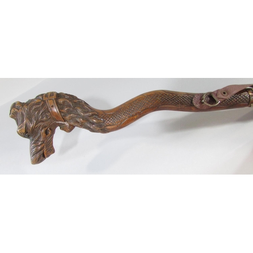 428 - Three walking sticks with carved wood heads of dogs, a hound, a Boxer and a hound with a sprung lowe... 