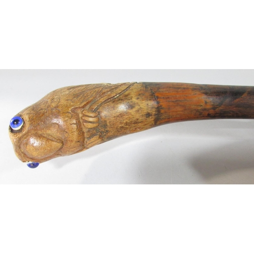 430 - Four walking sticks with carved wood Parrot head handles