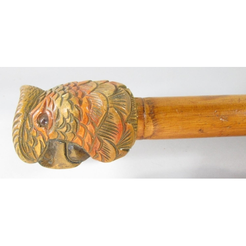 430 - Four walking sticks with carved wood Parrot head handles