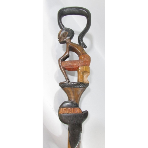 433 - Eight walking sticks, five with African themed carvings, one with a frog, one with a goat handle, an... 