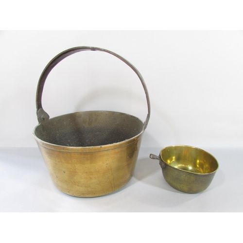 439 - A miscellaneous collection of items including a jam pan, copper kettle, scales, bellows, oil lamps, ... 