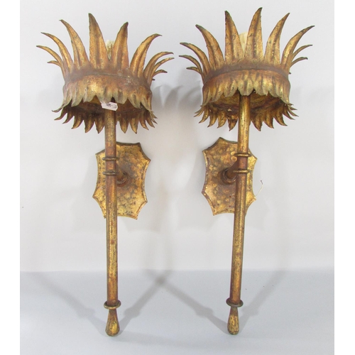 440 - A pair of early 20th century wall hung torcheres and a third similar all in a burnished gold finish.