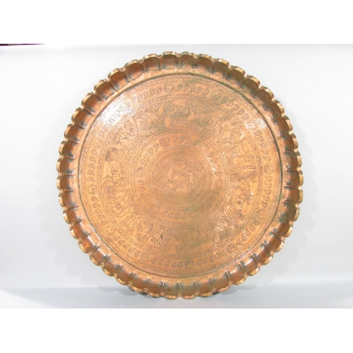 445 - A large brass  Mughal Indian copper engraved charger 69cm diameter , together with a copper preserve... 