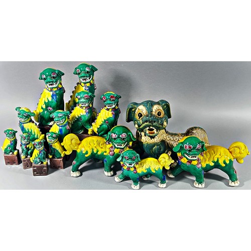 103 - Twenty six ceramic Dogs of Fo, various sizes and models principally in a green colourway, 46cm and s... 