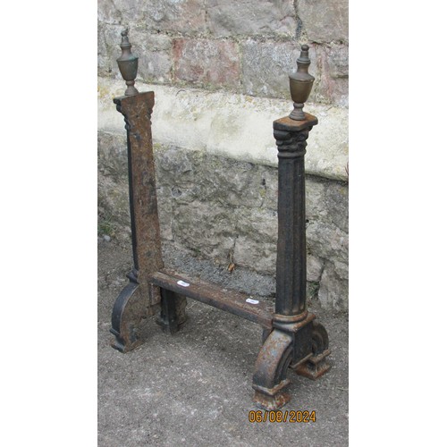 1123 - A pair of antique country house iron fire dogs, in the form of tapering fluted pilasters with brass ... 