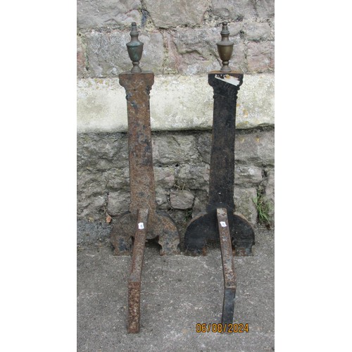 1123 - A pair of antique country house iron fire dogs, in the form of tapering fluted pilasters with brass ... 