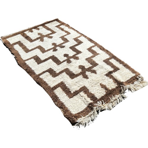 1757 - A Turkish Tula rug thick tufty wool pile with repeating tribal design, 190cm x 102cm approximately