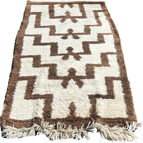 1757 - A Turkish Tula rug thick tufty wool pile with repeating tribal design, 190cm x 102cm approximately