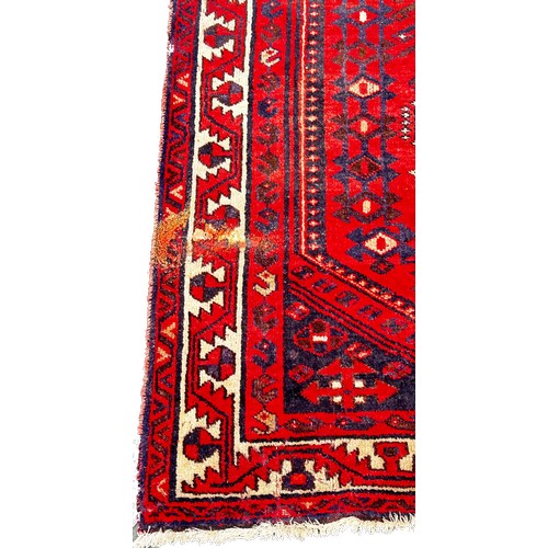 1762 - An old Turkoman carpet with three central medallions on a predominantly red ground, 250cm x 160cm ap... 