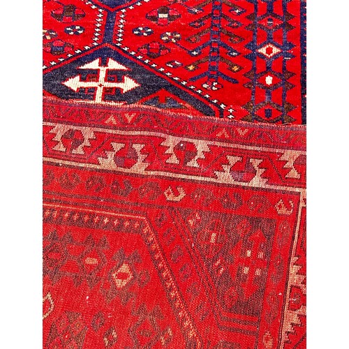 1762 - An old Turkoman carpet with three central medallions on a predominantly red ground, 250cm x 160cm ap... 