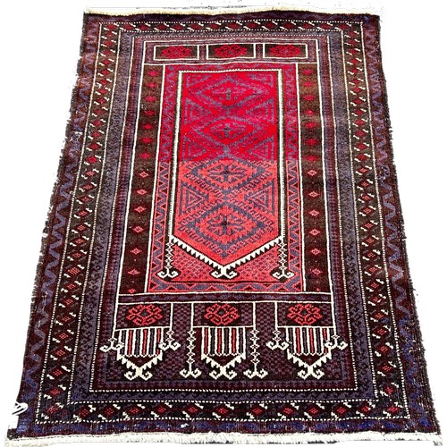 1775 - A Baluchi prayer rug, in brown, purple and varying crimson tones, wool on wool, approx. 130 x 82 cm