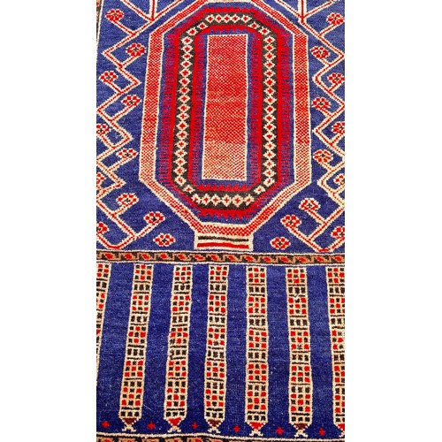 1773 - An old Baluchi rug with rhombic stepped medallion flanked by the stylised broken branch design, wool... 