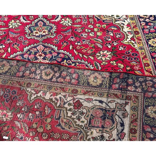 1787 - A Tabriz style carpet with a central floral medallion on a floral red ground, 260cm x 180cm approxim... 