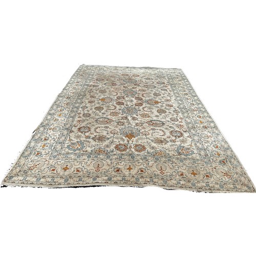 1791 - A Persian hand made carpet circa 1950’s with an all over floral pattern on an ivory ground, 335cm x ... 