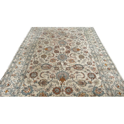 1791 - A Persian hand made carpet circa 1950’s with an all over floral pattern on an ivory ground, 335cm x ... 