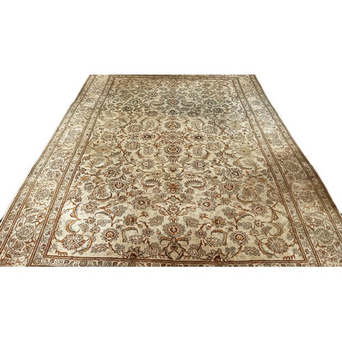 1792 - A Middle Eastern hand made carpet circa 1950’s, with a scrolled floral pattern on a ivory ground, 32... 