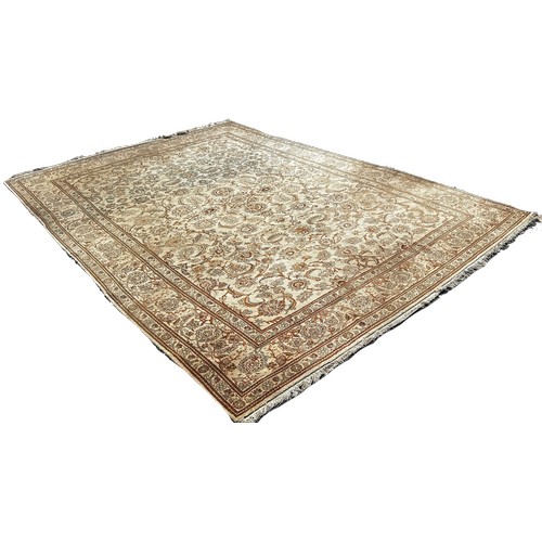 1792 - A Middle Eastern hand made carpet circa 1950’s, with a scrolled floral pattern on a ivory ground, 32... 