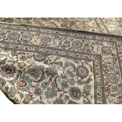 1792 - A Middle Eastern hand made carpet circa 1950’s, with a scrolled floral pattern on a ivory ground, 32... 