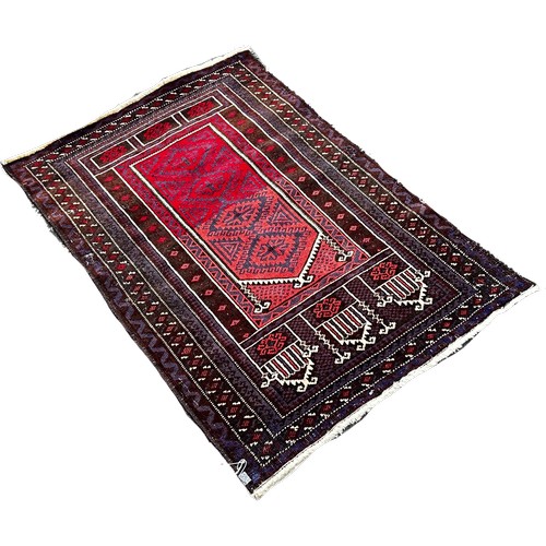 1775 - A Baluchi prayer rug, in brown, purple and varying crimson tones, wool on wool, approx. 130 x 82 cm