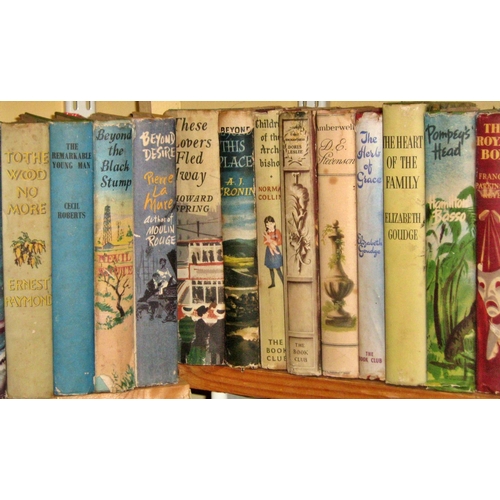 636 - An extensive library of mid 20th century novels, in original dust jackets, including Georgette Heyer... 