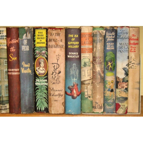 636 - An extensive library of mid 20th century novels, in original dust jackets, including Georgette Heyer... 