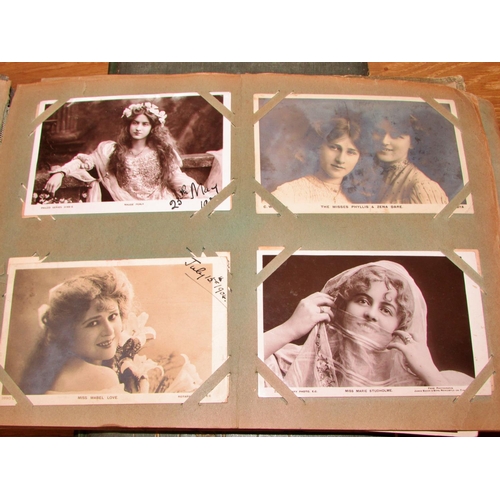 676 - A collection of late Victorian and early 20th century postcards in two albums to include famous actr... 