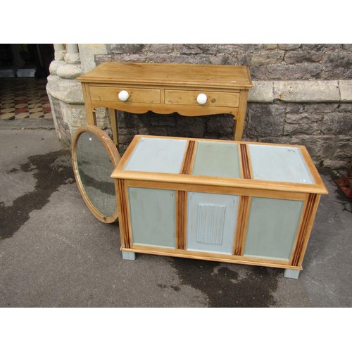 1147 - A small stripped pine side table, an over painted coffer and a pine framed oval mirror (3)