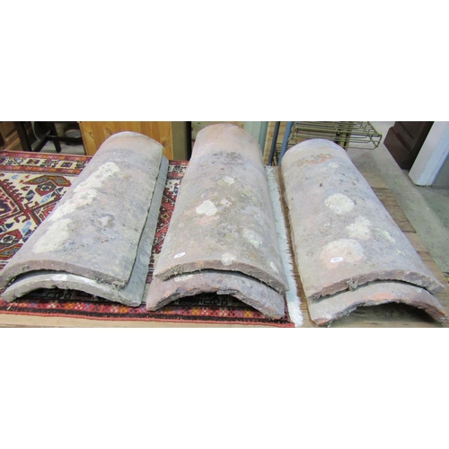 1158 - Six large 18th century or later provincial French roof tiles of curved tapering form, 72 x 29 cm max