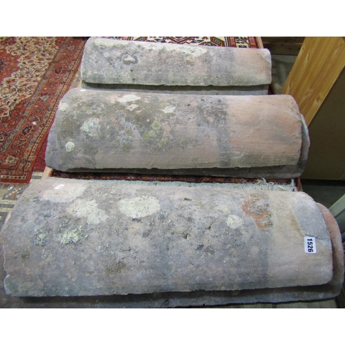 1158 - Six large 18th century or later provincial French roof tiles of curved tapering form, 72 x 29 cm max