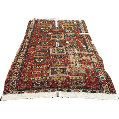 1784 - An old Sumak carpet, very worn and faded, repeating geometric patterns, 300cm x 165cm approximately