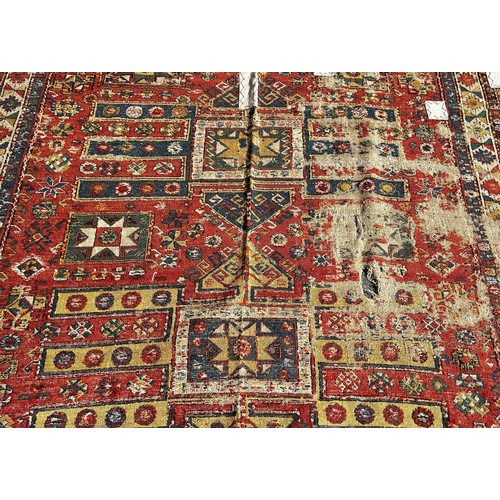 1784 - An old Sumak carpet, very worn and faded, repeating geometric patterns, 300cm x 165cm approximately