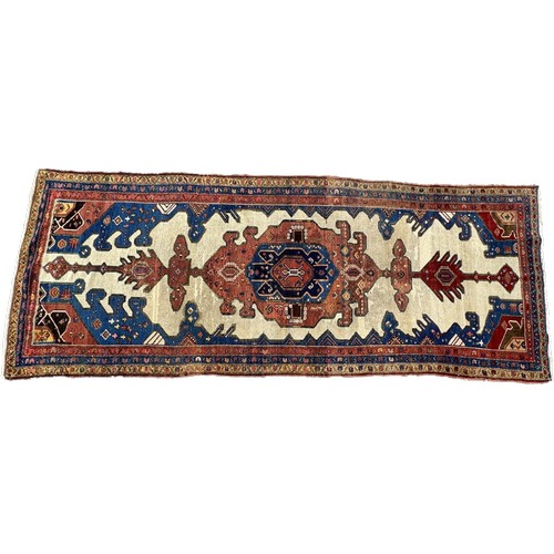 1755 - An old Persian Kelleh runner with an elongated hooked and stepped medallion 325cm x 125cm approximat... 