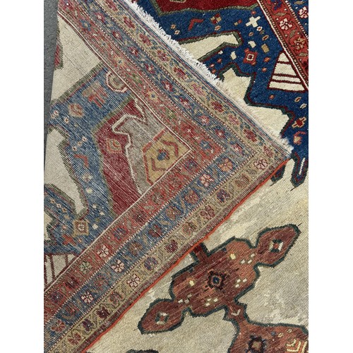 1755 - An old Persian Kelleh runner with an elongated hooked and stepped medallion 325cm x 125cm approximat... 