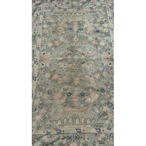 1771 - A Kashmiri Crewel Work rug with an overall floral pattern, 165cm x 98cm approximately