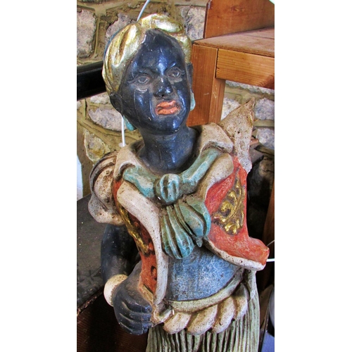 435 - A 19th century Venetian carved and painted wood ‘Blackamoor’ figural torchere stand (A/F) 122cm high... 