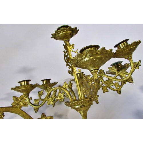 537 - A heavy antique ecclesiastical brass pricket candlestick in the old English style, with tapering tur... 