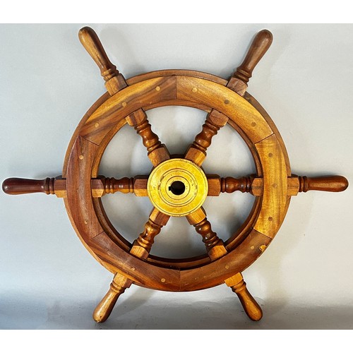 515 - A reproduction wooden ship’s wheel, 61cm dia