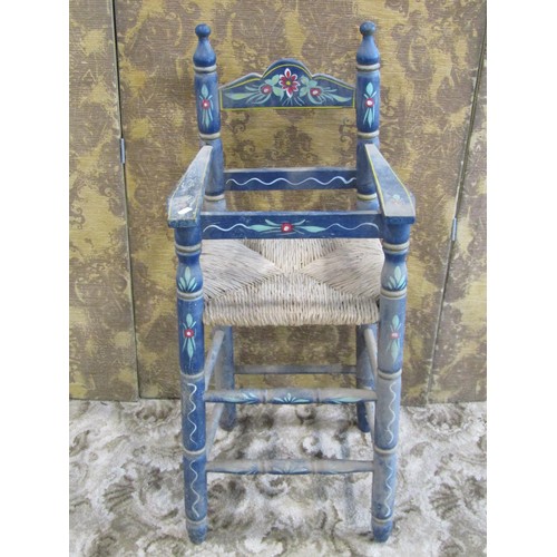 1182 - A barge art type painted countrymade pine high elbow chair with rush seat, 90cm high, together with ... 