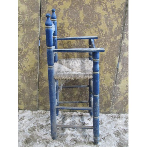 1182 - A barge art type painted countrymade pine high elbow chair with rush seat, 90cm high, together with ... 