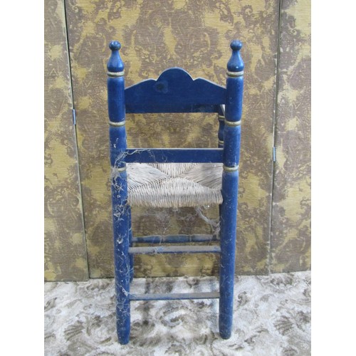 1182 - A barge art type painted countrymade pine high elbow chair with rush seat, 90cm high, together with ... 