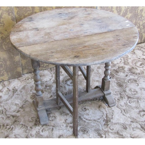 1185 - A primitive antique oak gateleg table of narrow proportions, together with a 19th century pine cover... 