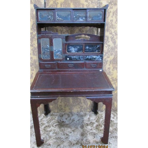 1190 - A 19th century Japanese lacquered writing desk, the raised back enclosing drawers and cupboards, lan... 