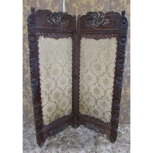 1191 - A late 19th century two panel screen of full height, with carved borders chrysanthemum and other flo... 