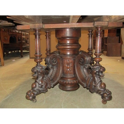 1243 - A Large Victorian oak D end dining table, raised on a central pillar with scroll and lion detail, wi... 