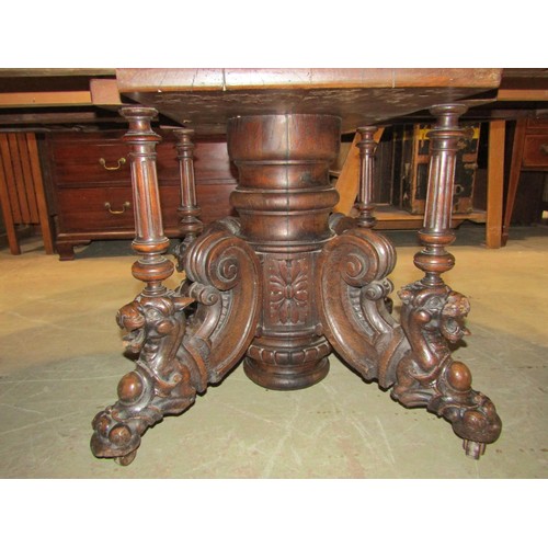 1243 - A Large Victorian oak D end dining table, raised on a central pillar with scroll and lion detail, wi... 